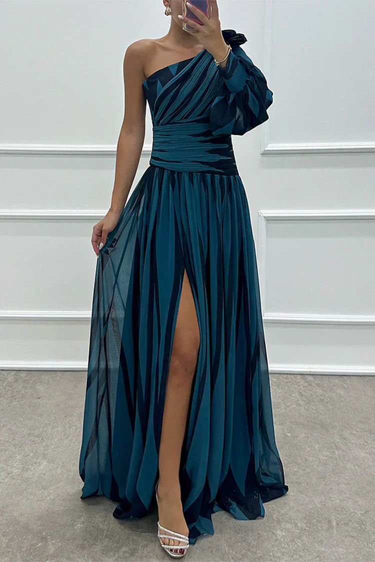 Female model wearing a striped event dress with a defined waist on a plain background.