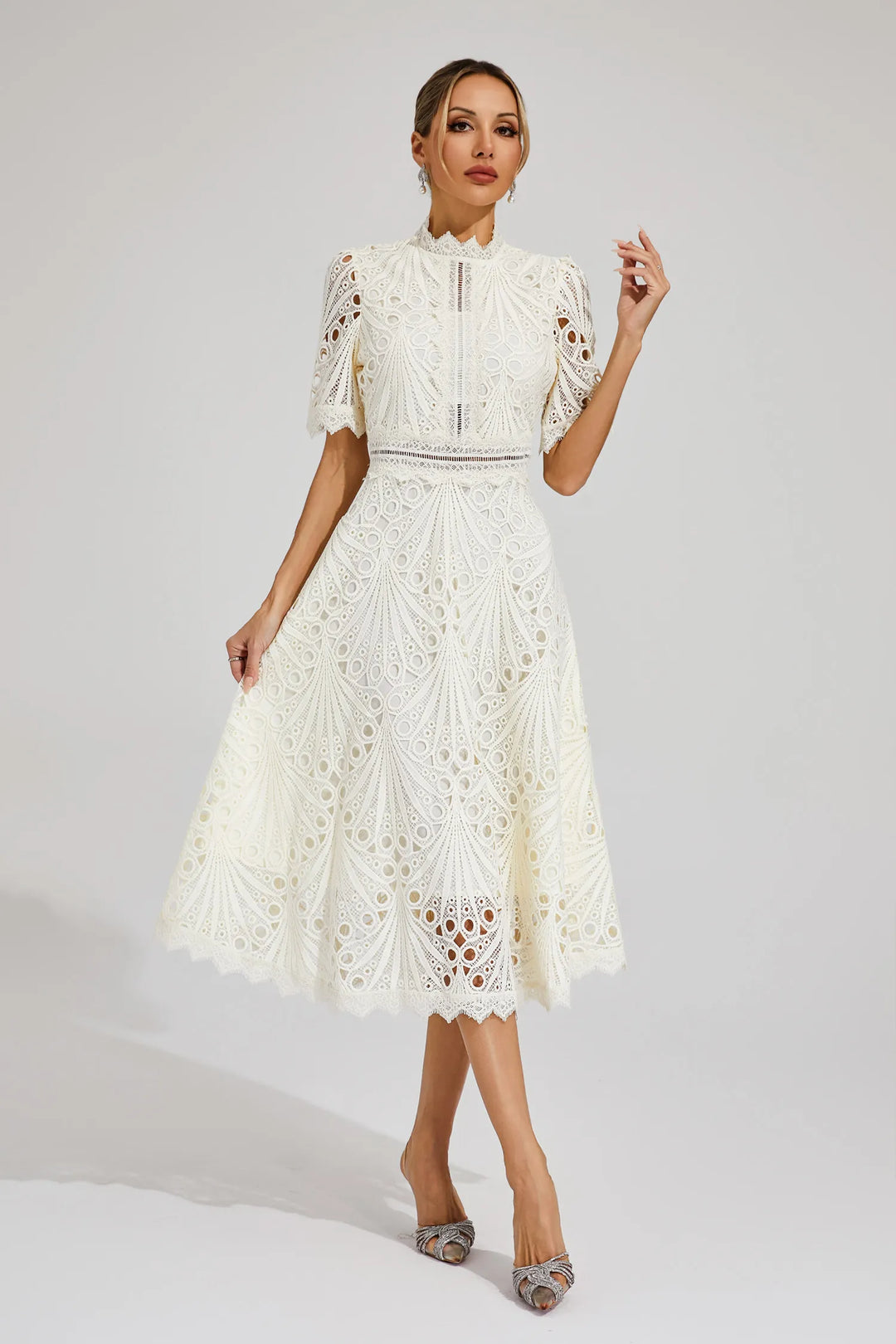 Elegant lace midi dress worn by a woman model on a minimal clean background, front view