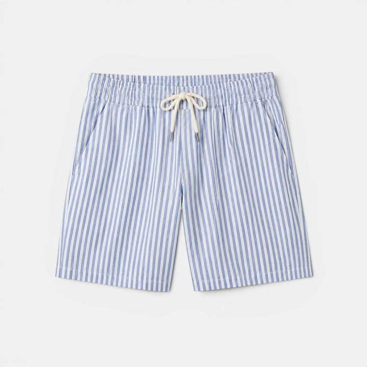  Male model presenting striped casual shorts with a plain background.