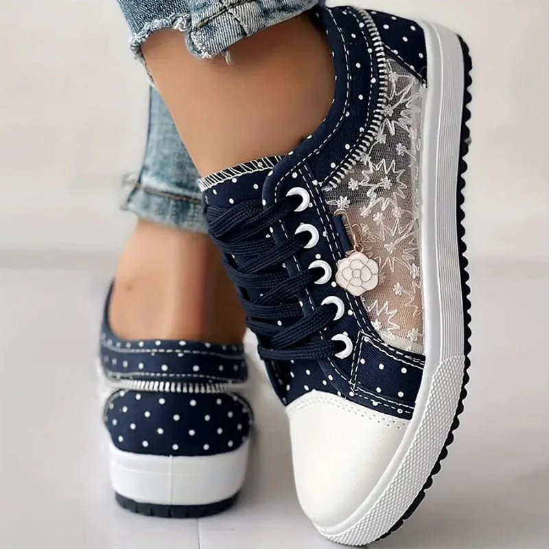 Pair of polka dot shoes with lace detail