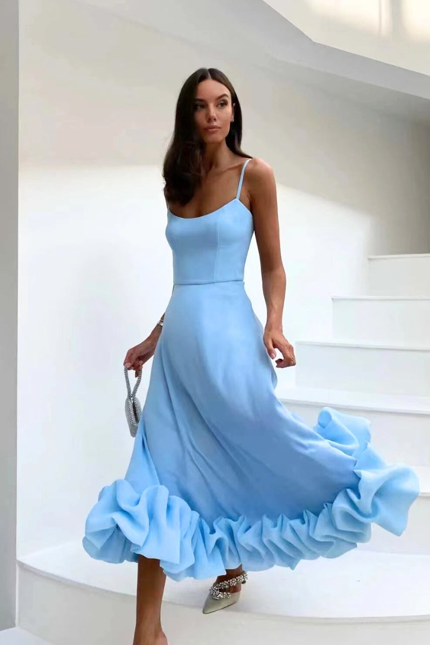 Flowy blue formal dress in dramatic heading down staircase