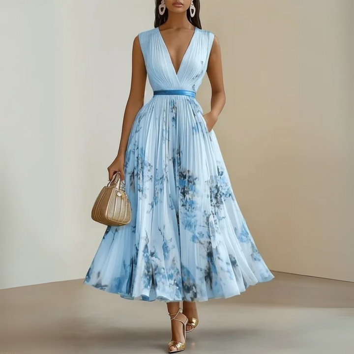 Casual warm-weather outfit with pleated movement shown on a plain background.