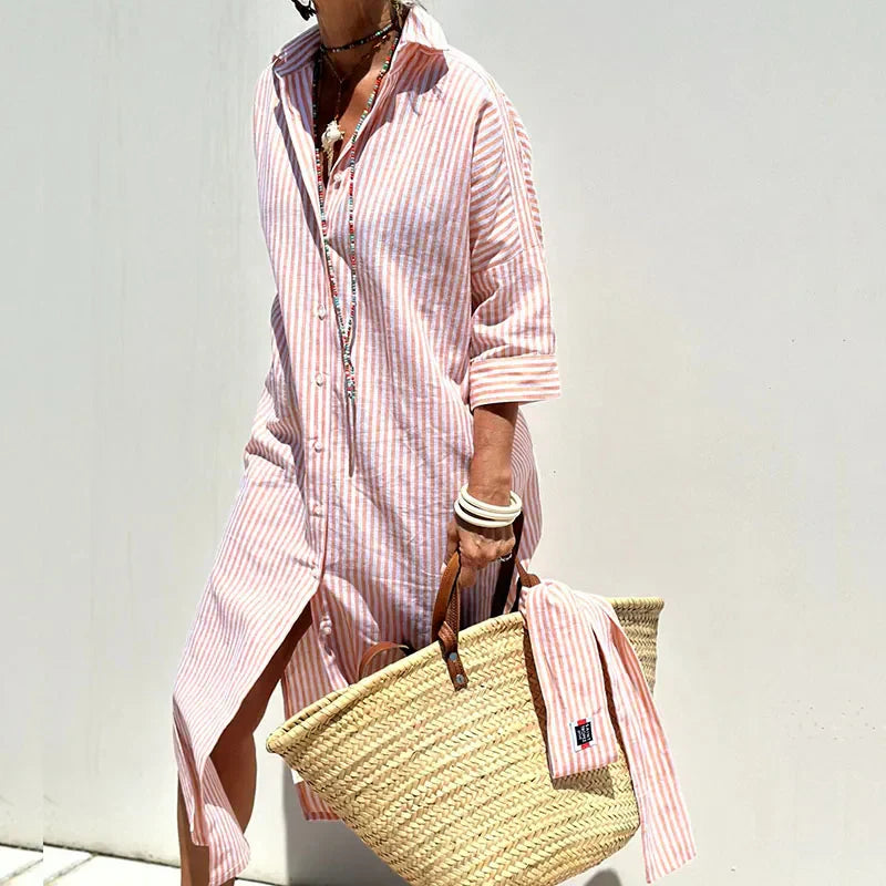 Front view of relaxed summer dress on plain background.