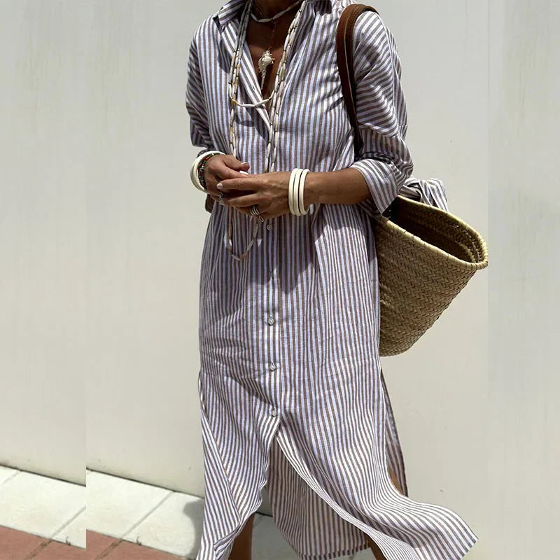 Model showcasing lightweight summer dress against plain background.