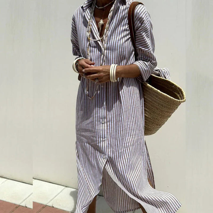 Model showcasing lightweight summer dress against plain background.