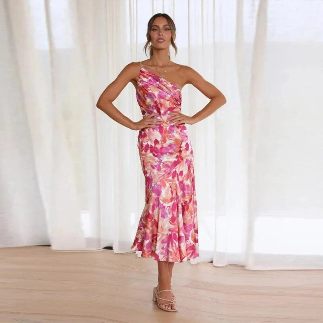 Woman styled in graceful floral fashion with a clean plain background.