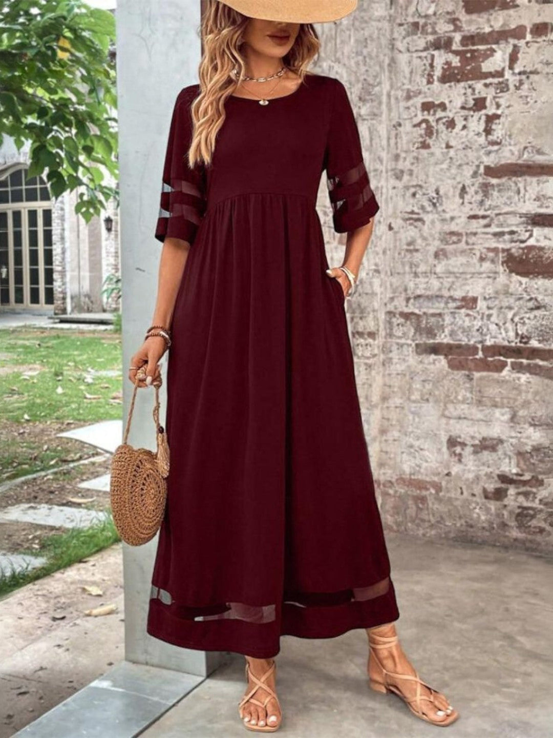 Burgundy dress on model outdoors background
