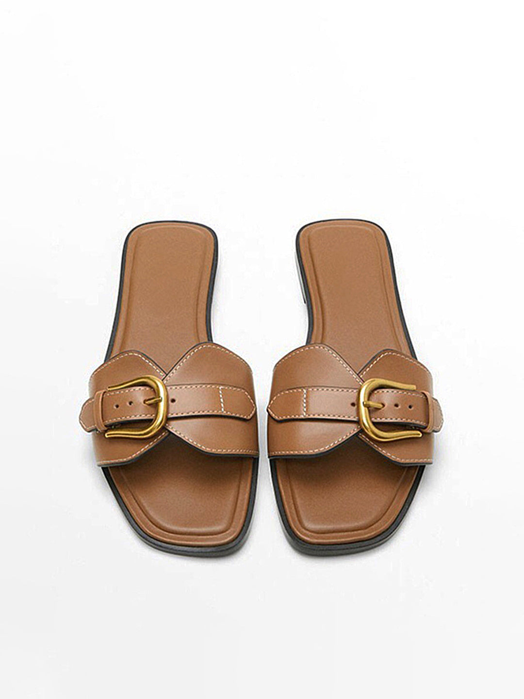 Front top foot wearing sandals on plain background balanced framing