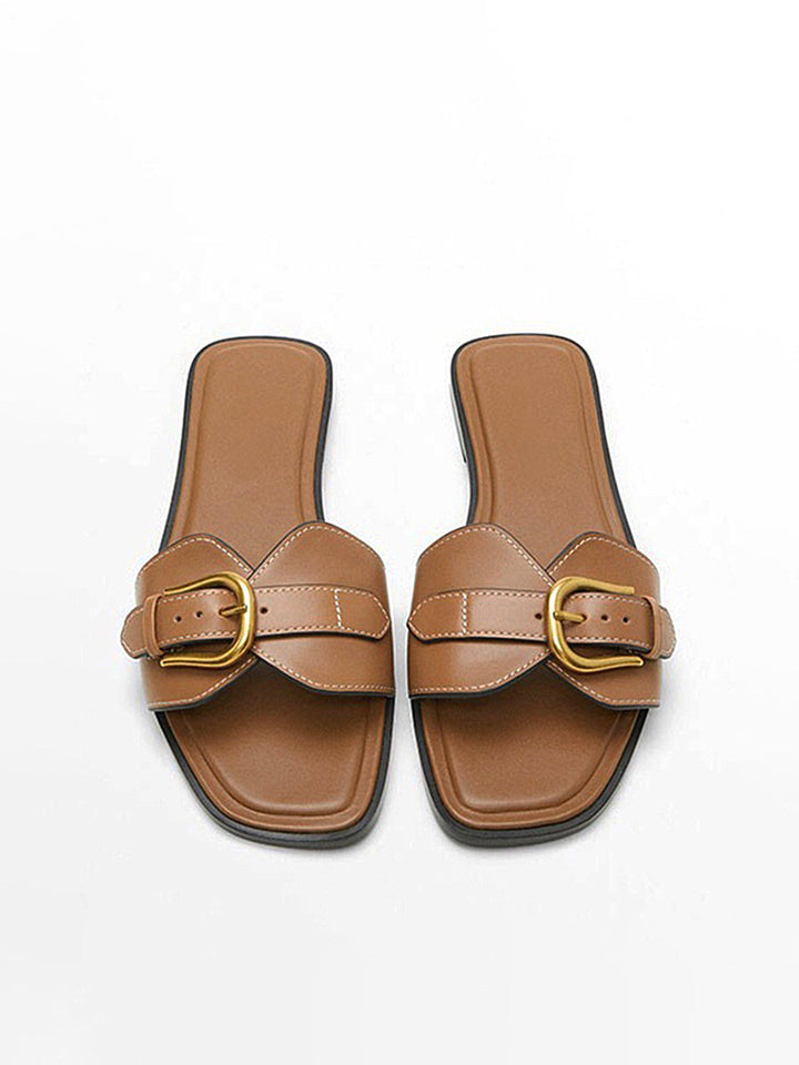 Front top foot wearing sandals on plain background balanced framing
