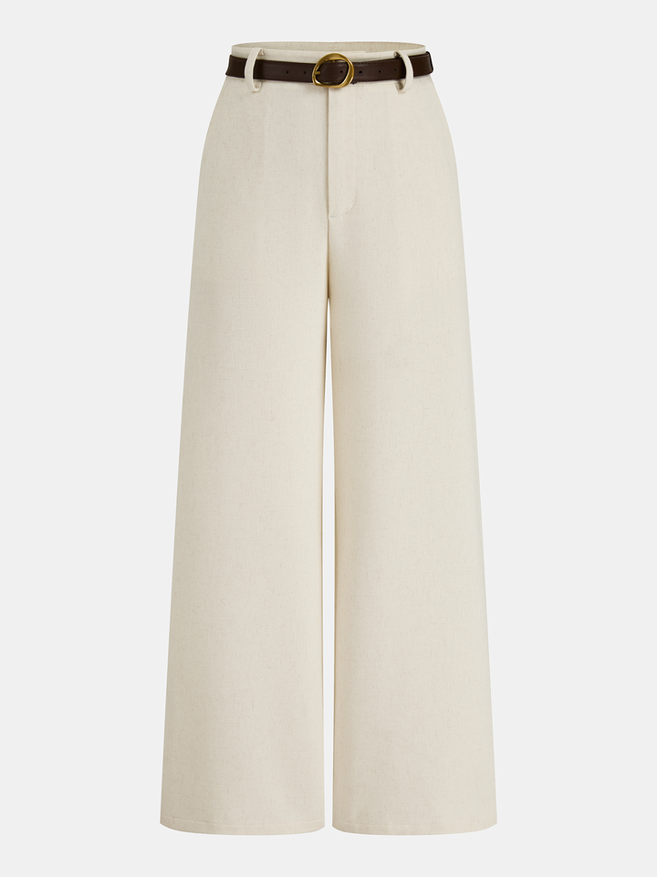 Female wearing belted long pants in a linen blend on a plain background.