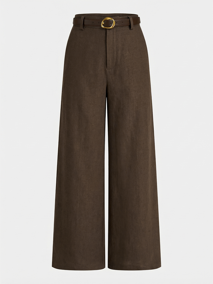 Female in long regular fit trousers designed with a modern belted waist on a plain background.
