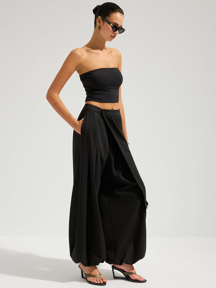 Female model in a polished long skirt against a plain background.