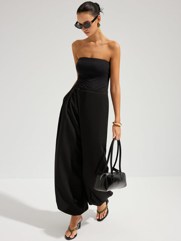 Female model wearing a long office skirt on a plain background.
