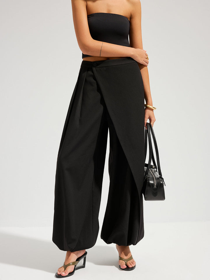 Woman in a refined long skirt for formal dressing on a plain background.