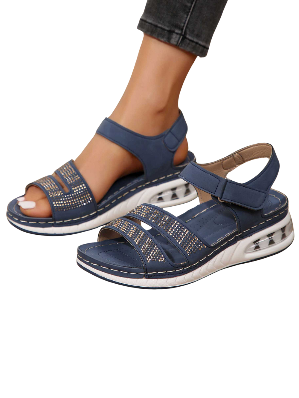 Foot wearing wedge sandals back angle on plain background view