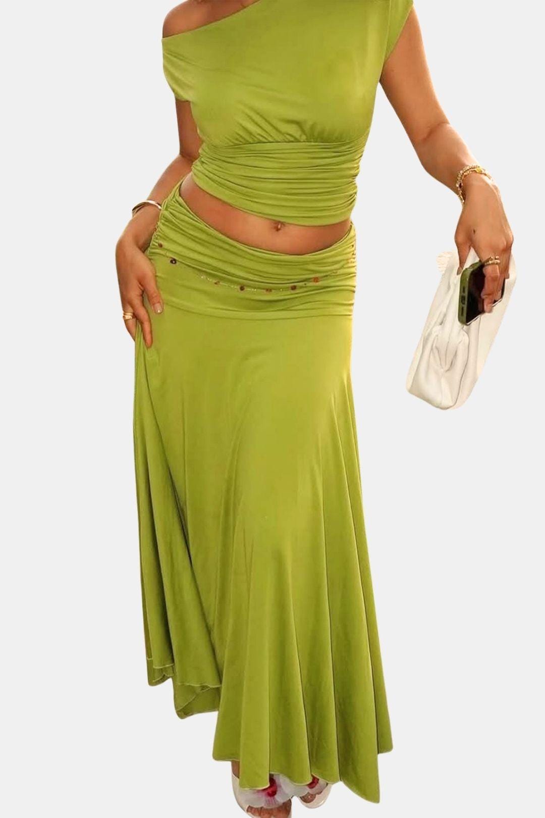 Two-piece maxi skirt outfit featuring ruched details and sleek styling.