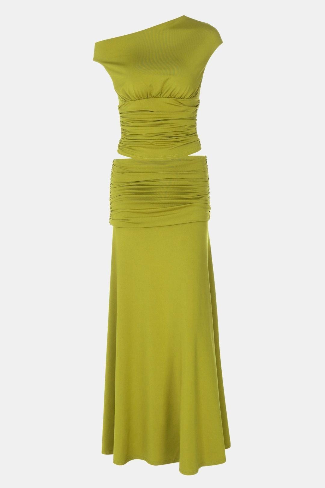 Stylish ruched skirt set with asymmetrical top on a plain background.