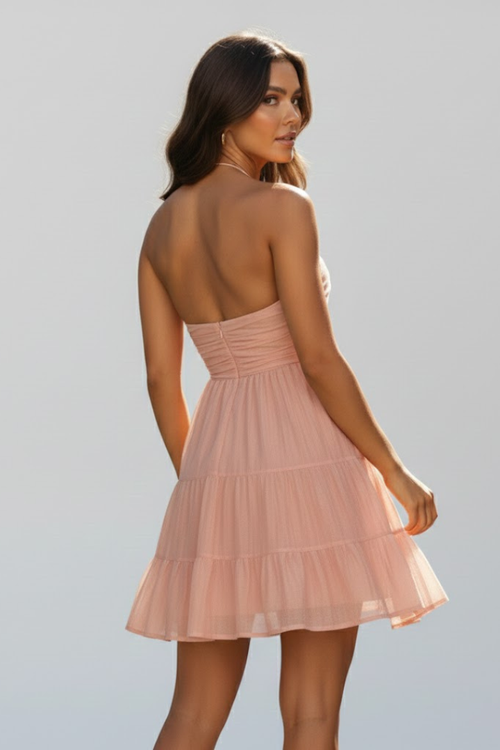 Model back view with layered skirt gray background