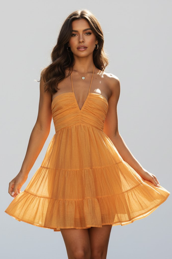Model close front pose with tiered yellow dress