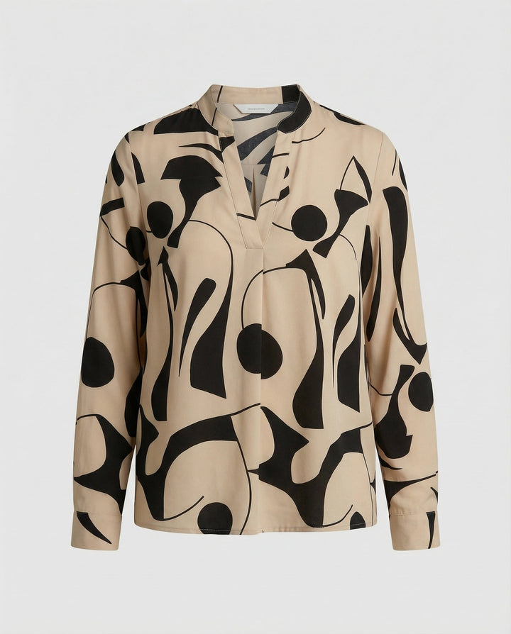 Woman wearing a versatile blouse suitable for work and casual occasions.