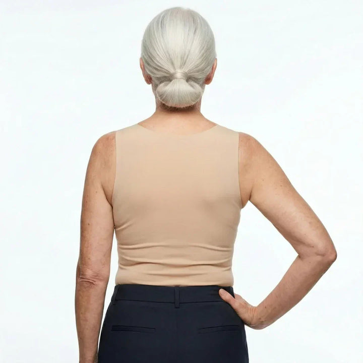 Model wearing a contemporary sleeveless tank with a flattering neckline on a plain background.