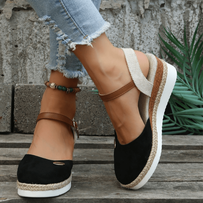 Front pose showing open toe sandals on foot model