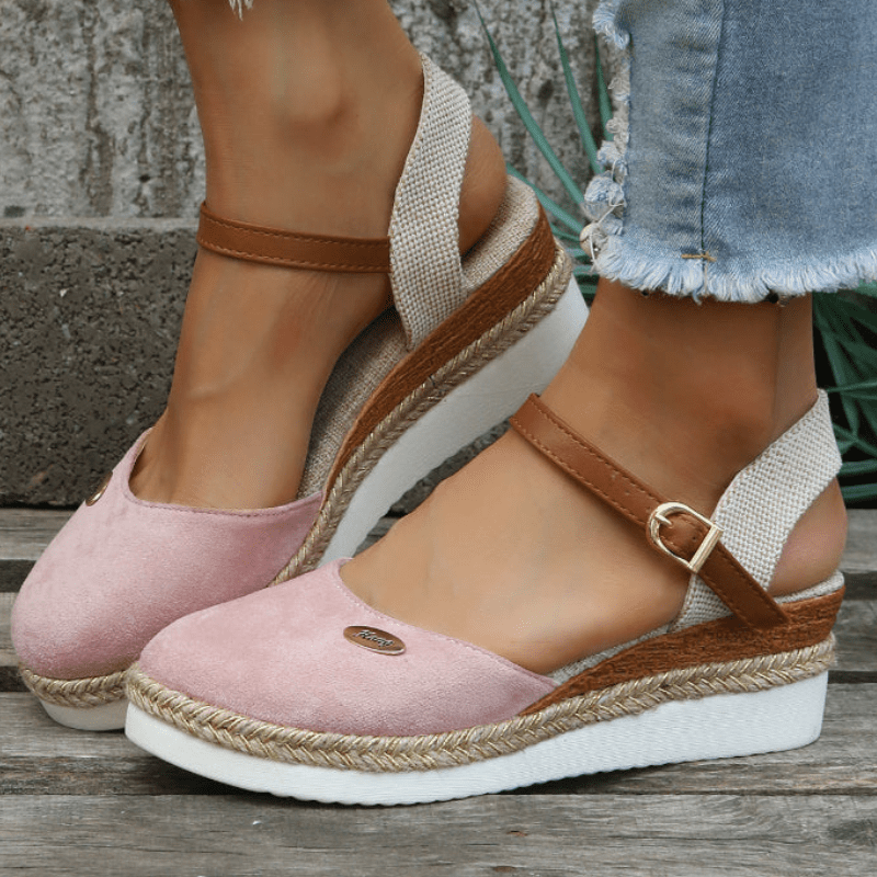 Side angle of summer sandals displayed on foot model