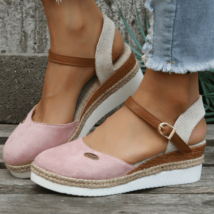 Side angle of summer sandals displayed on foot model