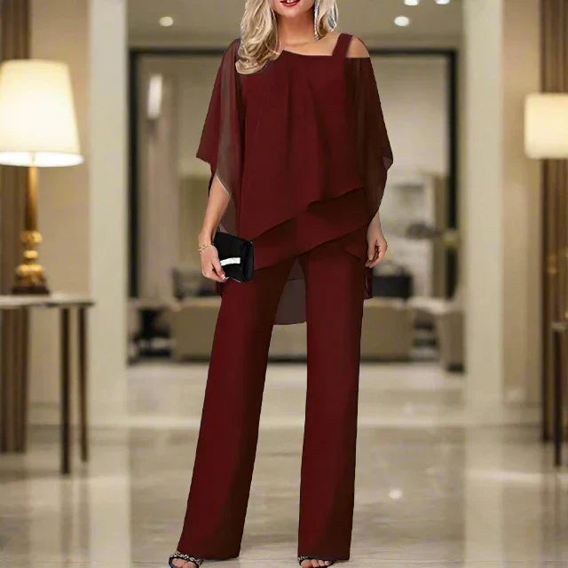 Woman wearing a loose top and trouser set with a clean finish.