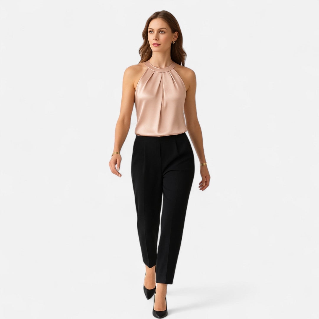 Woman model wearing a graceful satin tank styled for sophisticated everyday fashion on a clean background.