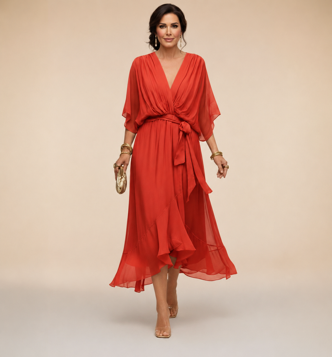 Woman wearing a flattering wrap midi dress on a plain background.
