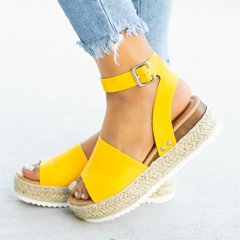 Foot model slight turn showing sandal profile from angle