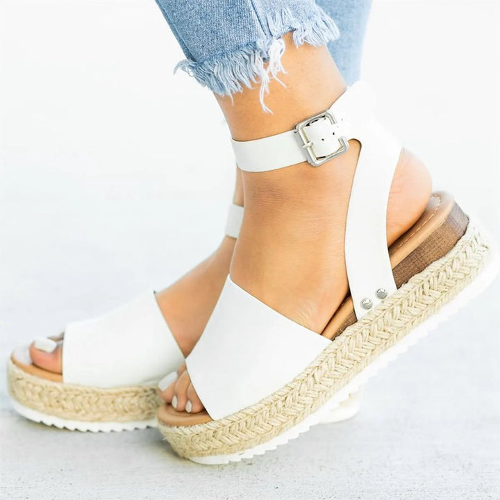 Side close foot image highlighting wedge elevation and comfort