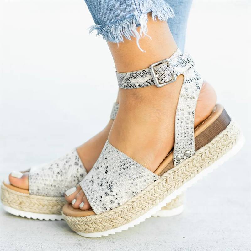 Side angled foot showing open structure and summer style