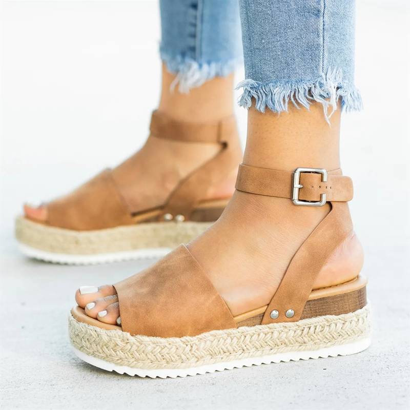 Side front foot image highlighting sandal structure and fit