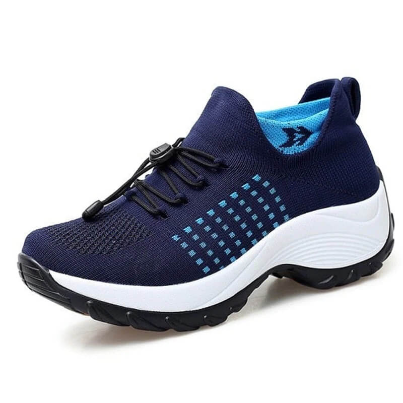 Knit sneakers shown from clean side profile white background