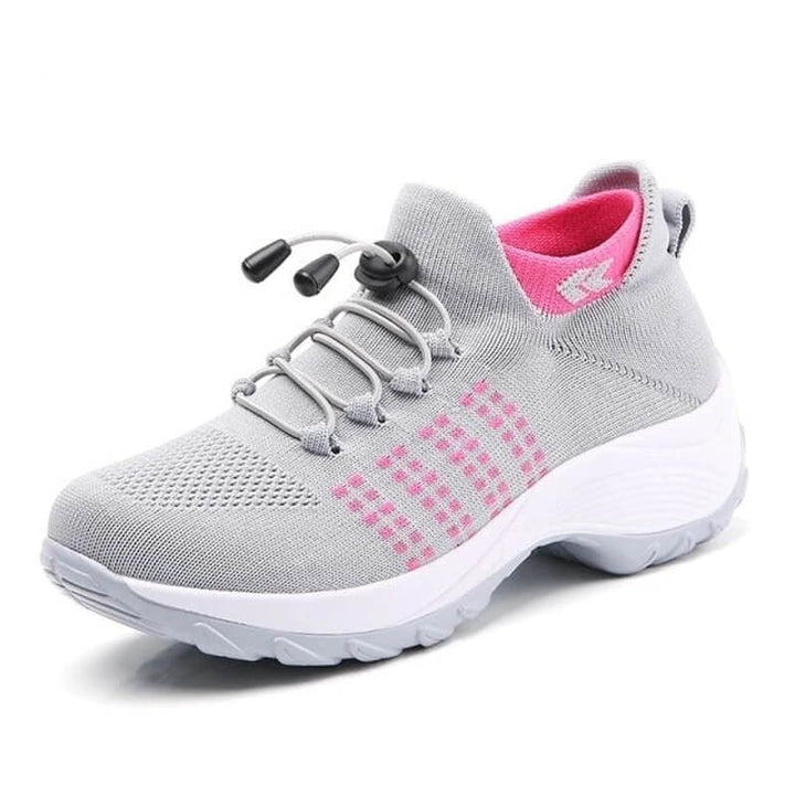 Grey comfort shoes featuring pink sock with thick supportive walking sole