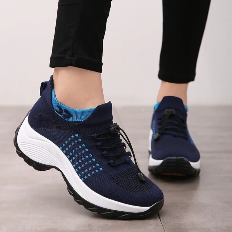 Side view knit walking shoes on neutral indoor background