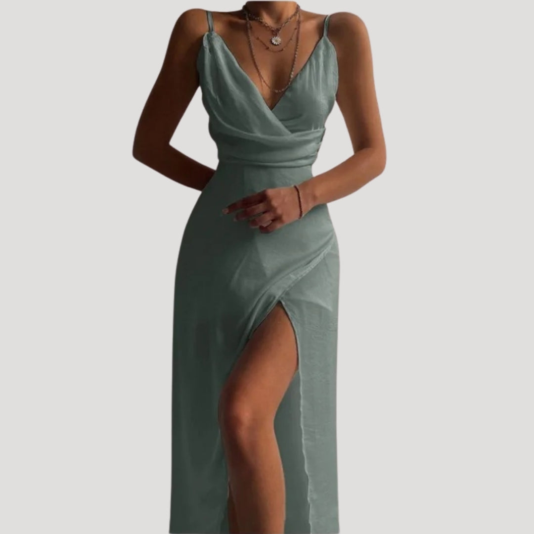 Model standing straight showing full length outfit plain background