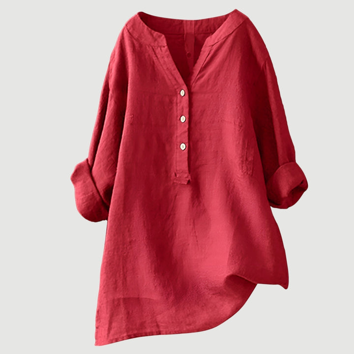 Stylish linen blouse with relaxed silhouette shown on plain background.