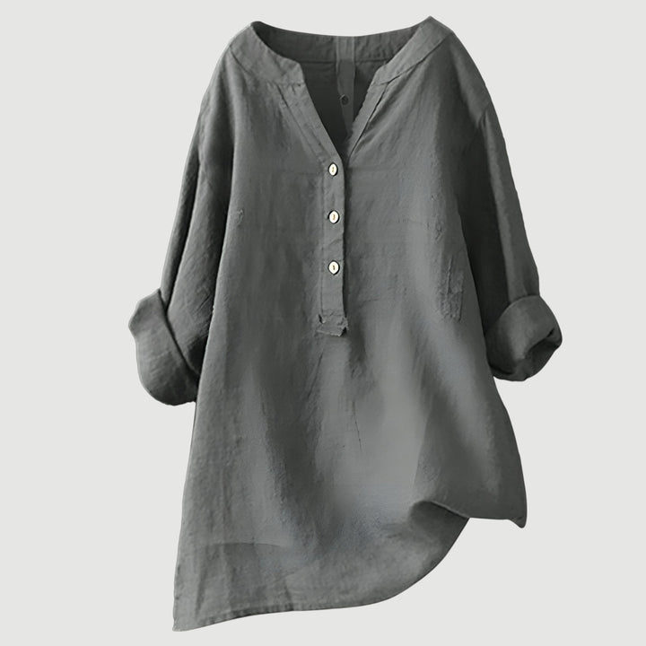 Timeless linen top for casual styling displayed on plain background.