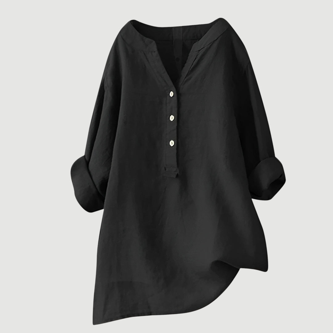 Lightweight women’s top made from breathable linen on plain background.