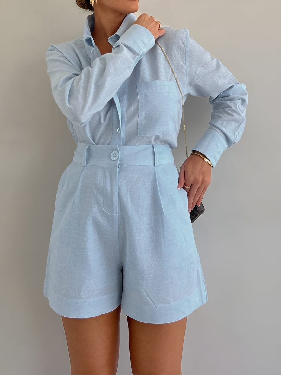 Woman styled in a casual two-piece outfit against a plain background.