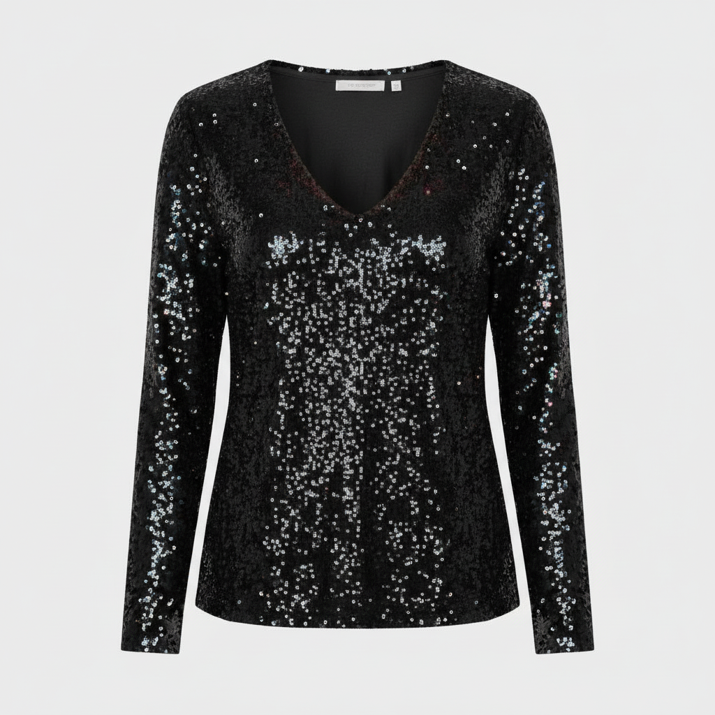 Woman wearing a glitter detail party top suitable for special occasions.
