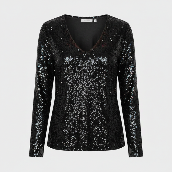 Woman wearing a glitter detail party top suitable for special occasions.
