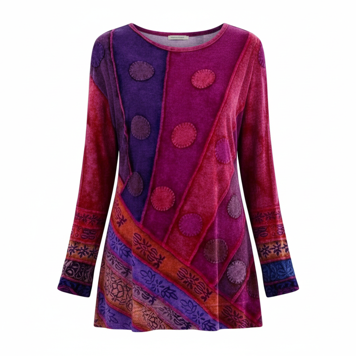 Woman wearing a patterned long-sleeve tunic designed for casual everyday styling.
