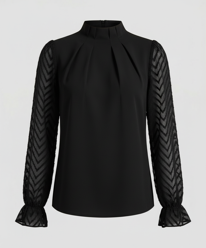 Woman wearing a long sleeve fashion top with a refined silhouette against a plain backdrop.