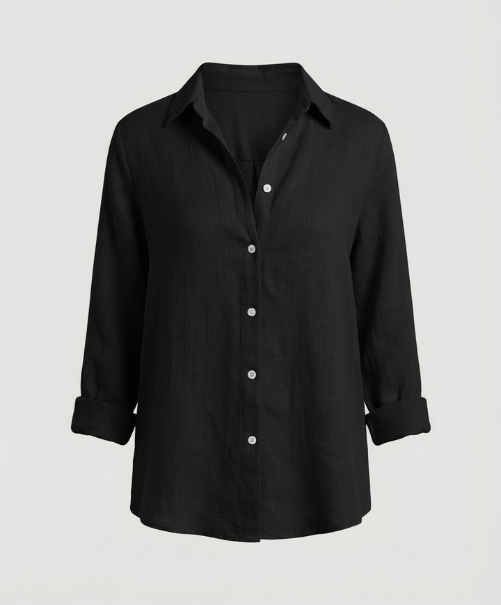 Woman showcasing a comfortable long-sleeve blouse with a refined appearance.
