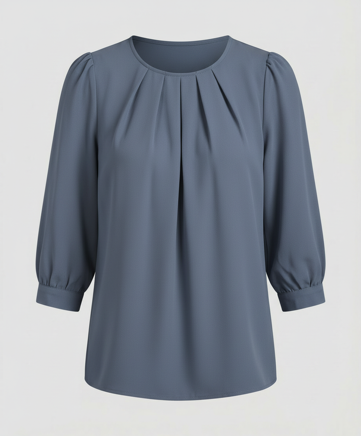 Female model wearing a pleated satin blouse designed for versatile styling.
