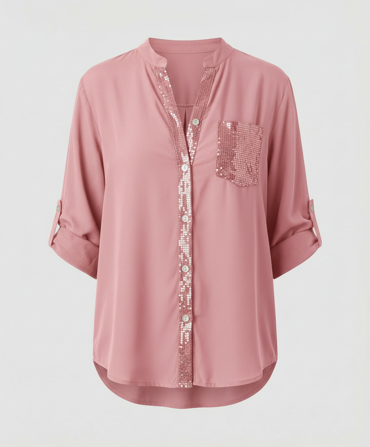 Versatile blouse with rolled sleeves and sequin pocket detail.